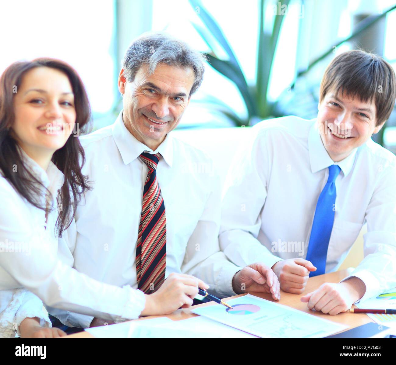 Happy group of business people smiling at the office Stock Photo - Alamy