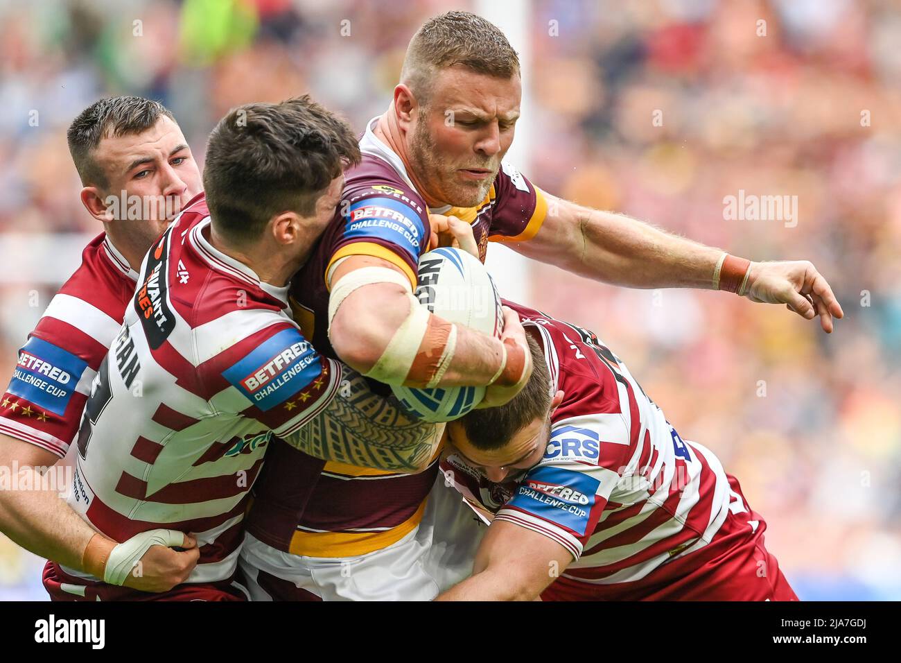 Josh Jones #11 of Huddersfield Giants is tackled by John Bateman #13 of  Wigan Warriors in, on 5/28/2022. (Photo by Craig Thomas/News Images/Sipa  USA) Credit: Sipa USA/Alamy Live News Stock Photo -