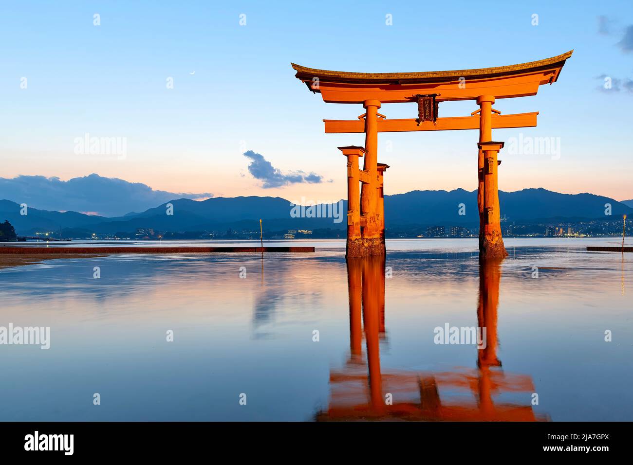 Japan. Miyajima. Hiroshima. Itsukushima Shrine and floating torii gate at sunset Stock Photo