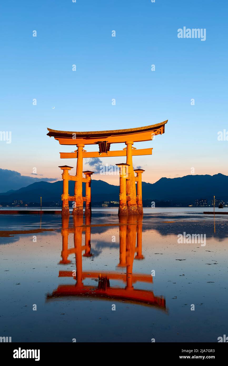 Japan. Miyajima. Hiroshima. Itsukushima Shrine and floating torii gate at sunset Stock Photo