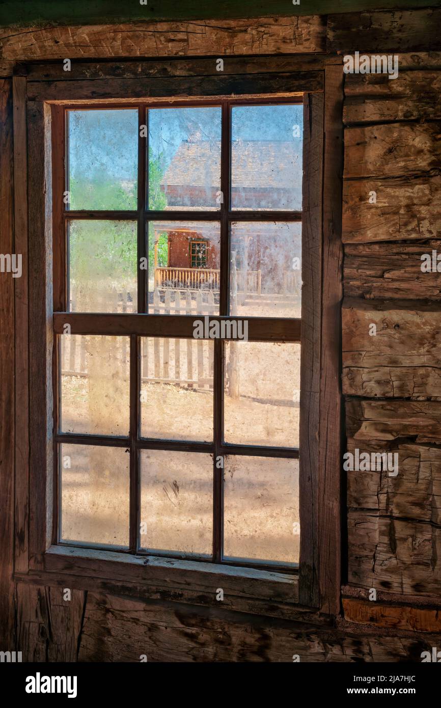 Old window in the ghost town of Grafton, Utah. The distant porch featured as that of Etta Place in the in movie Butch Cassidy & the Sundance Kid Stock Photo