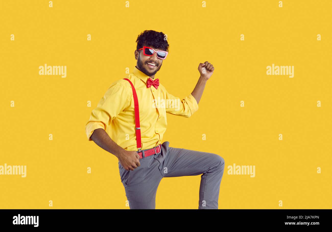Funny happy cheerful young Indian guy celebrating, dancing and having fun  at party Stock Photo - Alamy