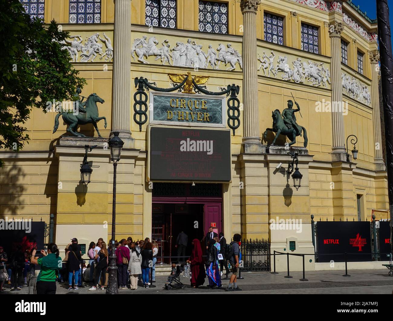 Paris, FR. 28th May, 2022. People line up for admission to the NETFLIX: Stranger Things Festival held at Cirque d’Hiver Bouglione, Rue Amelot, 11th Arrondissement. While launching the 4th season of Stranger Things, Netflix invited the public to explore the upside down world at Cirque d’Hiver Bouglione with the Stranger Things Festival, May 26 to 29, 2022. Stock Photo