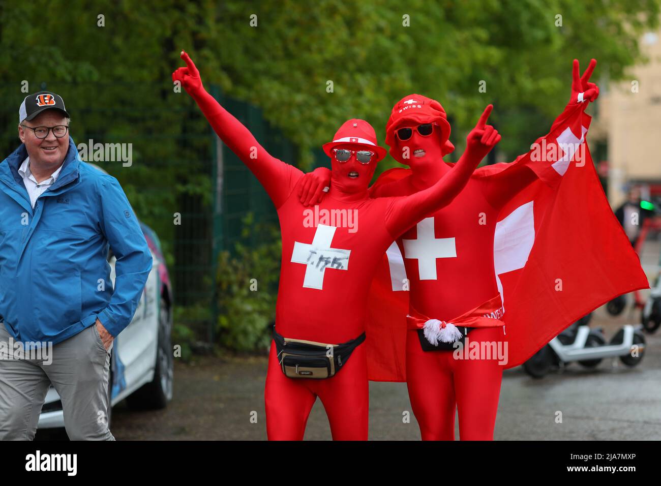 Fans of the Swiss ice hockey national team, dressed in costumes with national symbols, gathered in front of the stadium before the quarterfinal match between USA and Switzerland. Fans came from all over the world to support their teams at Helsinki Ice Hall. Stock Photo