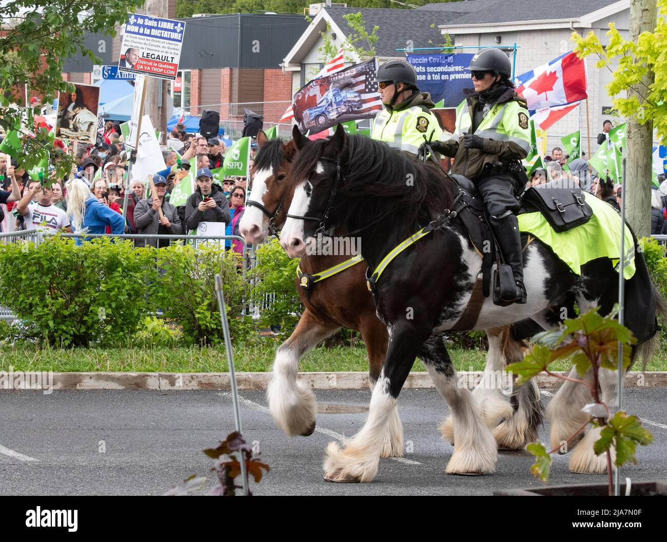 Surete du Quebec mounted police officers patrol the grounds of the