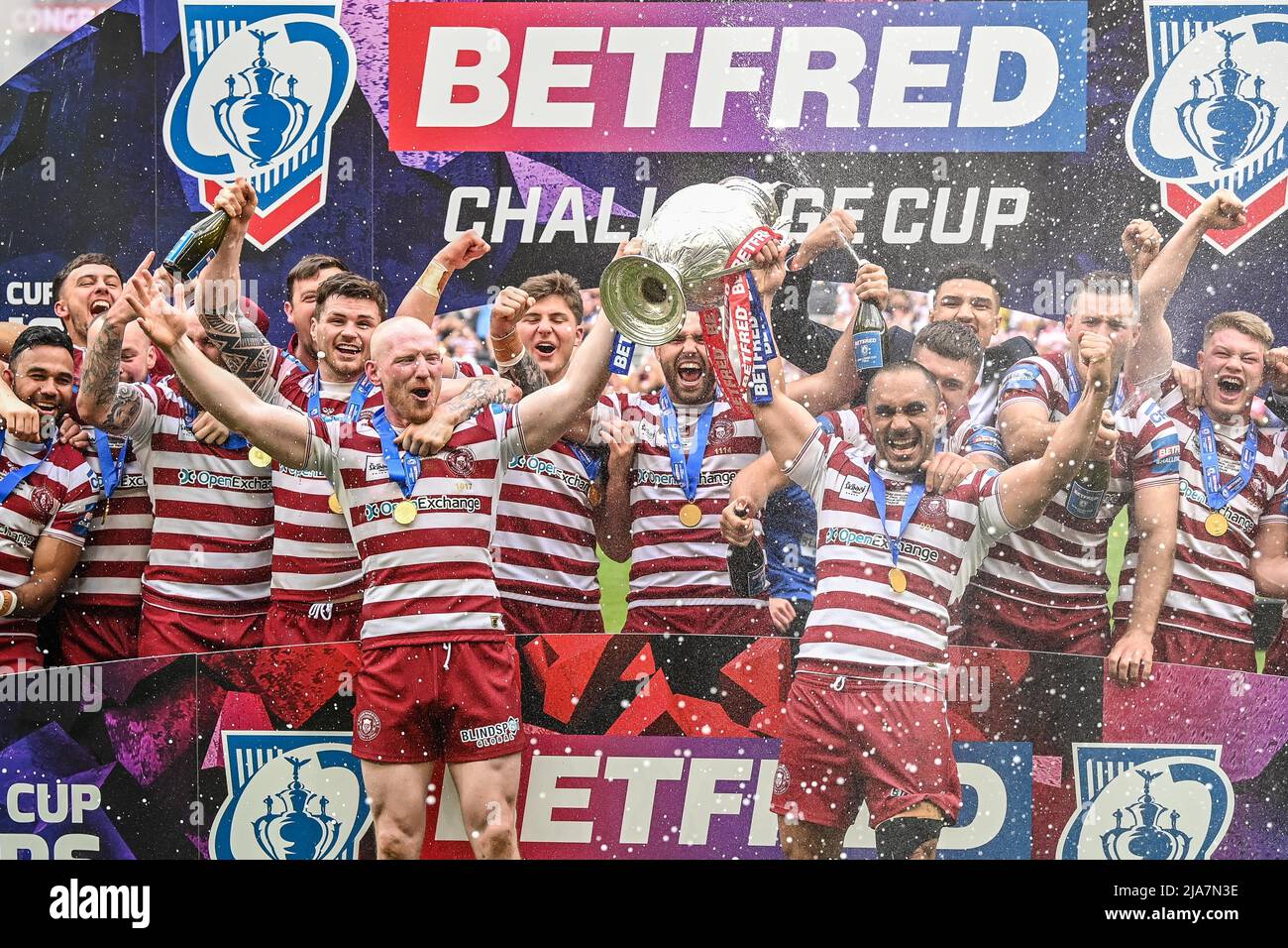Liam Farrell 12 And Thomas Leuluai 7 Of Wigan Warriors Lift The Trophy And Celebrate Winning 