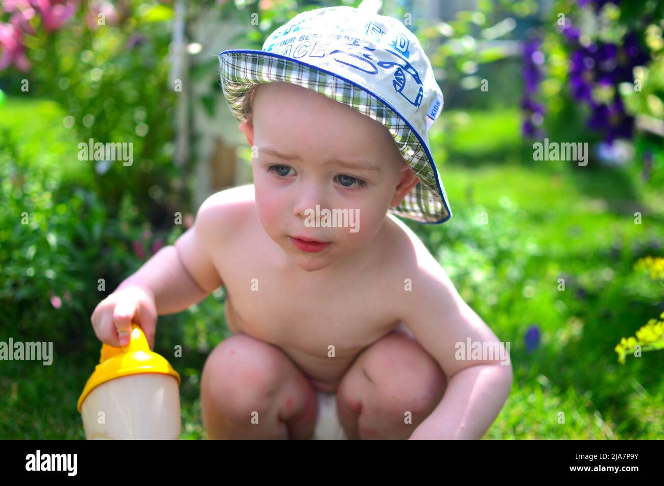 Hat summer watering watering hi-res stock photography and images - Page 6 -  Alamy