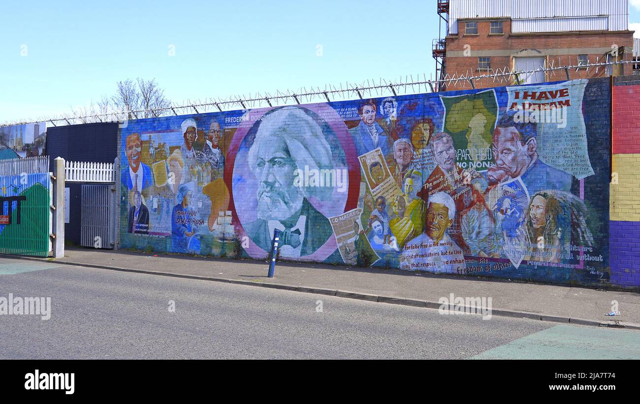 The famous Wall Murals of Belfast on the houses and Peace Wall