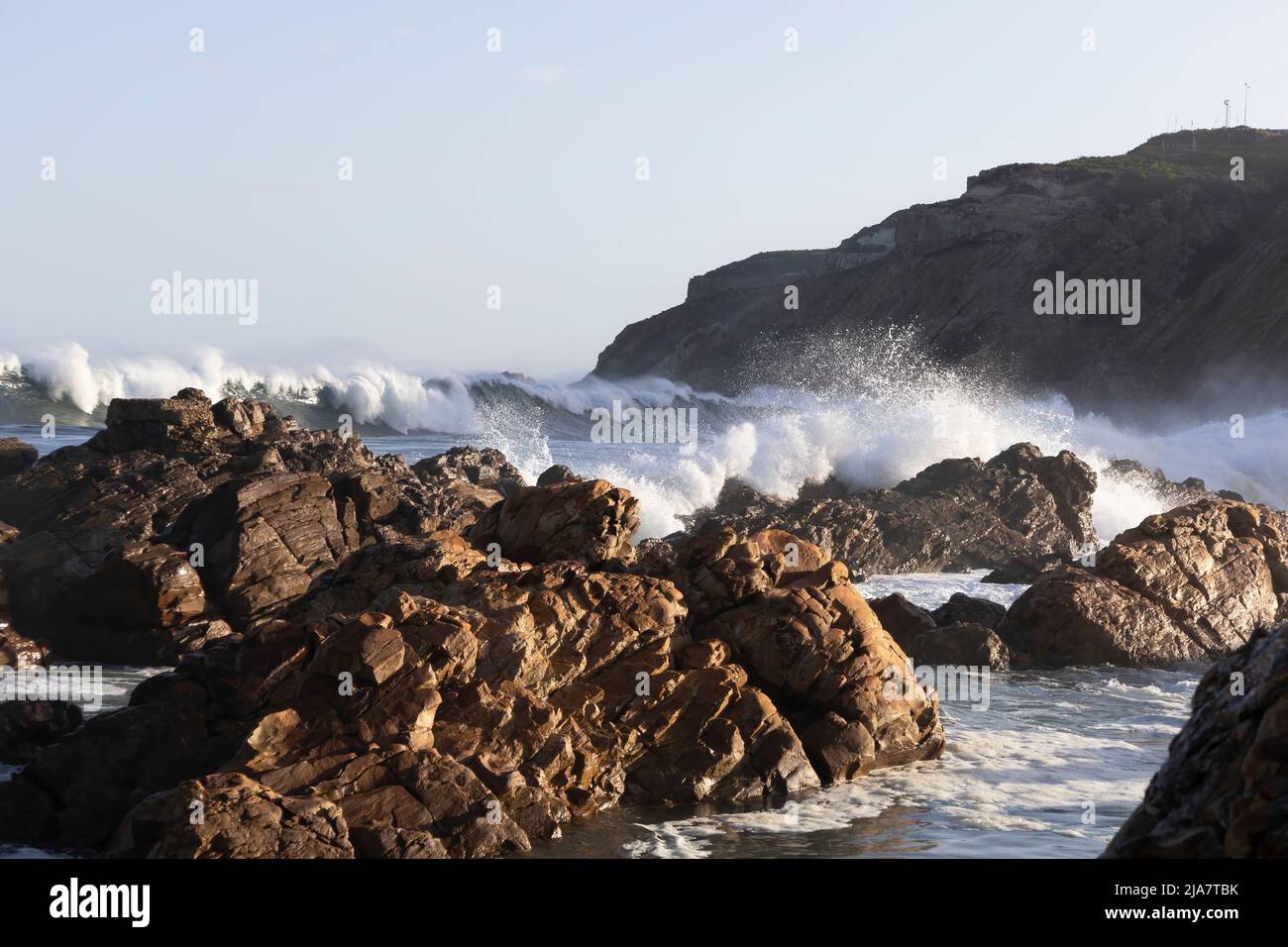 Waves crashing on the rocks at Mossel Bay on the Garden Route of South Africa Stock Photo