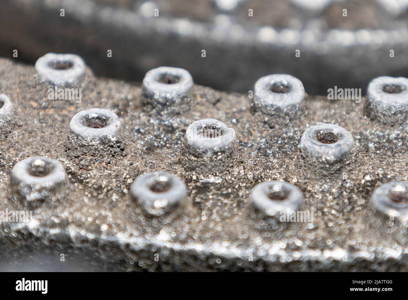 The small gas outlet holes on a gas cooker Stock Photo