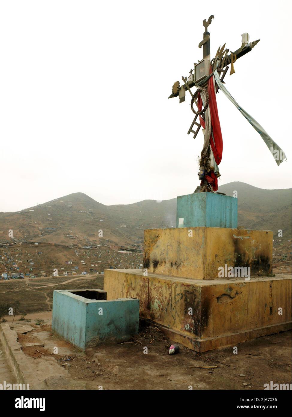 Crucifix at the top of the hill at the cemetery of Nueva Esperanza, in the district of Villa el Salvador in Lima. It is one of the largest in the Americas and receives almost two million visitors each year, only on the day of the dead. Stock Photo