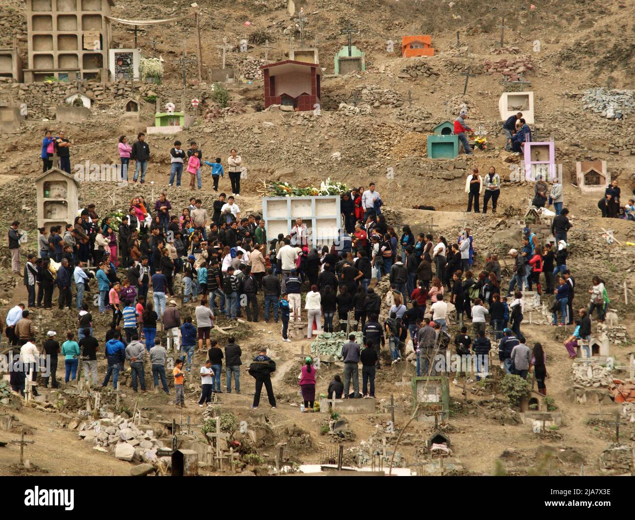 A funeral at the cemetery of Nueva Esperanza, in the district of Villa el Salvador in Lima. It is one of the largest in the Americas and receives almost two million visitors each year, only on the day of the dead. Stock Photo