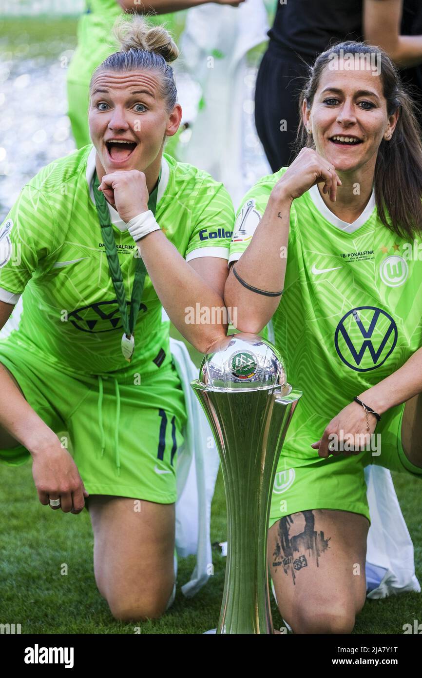 Cologne, Germany. 28th May, 2022. Alexandra Popp (11 VFL Wolfsburg) and Anna Blaesse (9 VFL Wolfsburg) celebrate their win with the Cup at the DFB Cup Final between VfL Wolfsburg and 1. FFC Turbine Potsdam at the Rhein-Energie-Stadion in Cologne Tatjana Herzberg/SPP Credit: SPP Sport Press Photo. /Alamy Live News Stock Photo