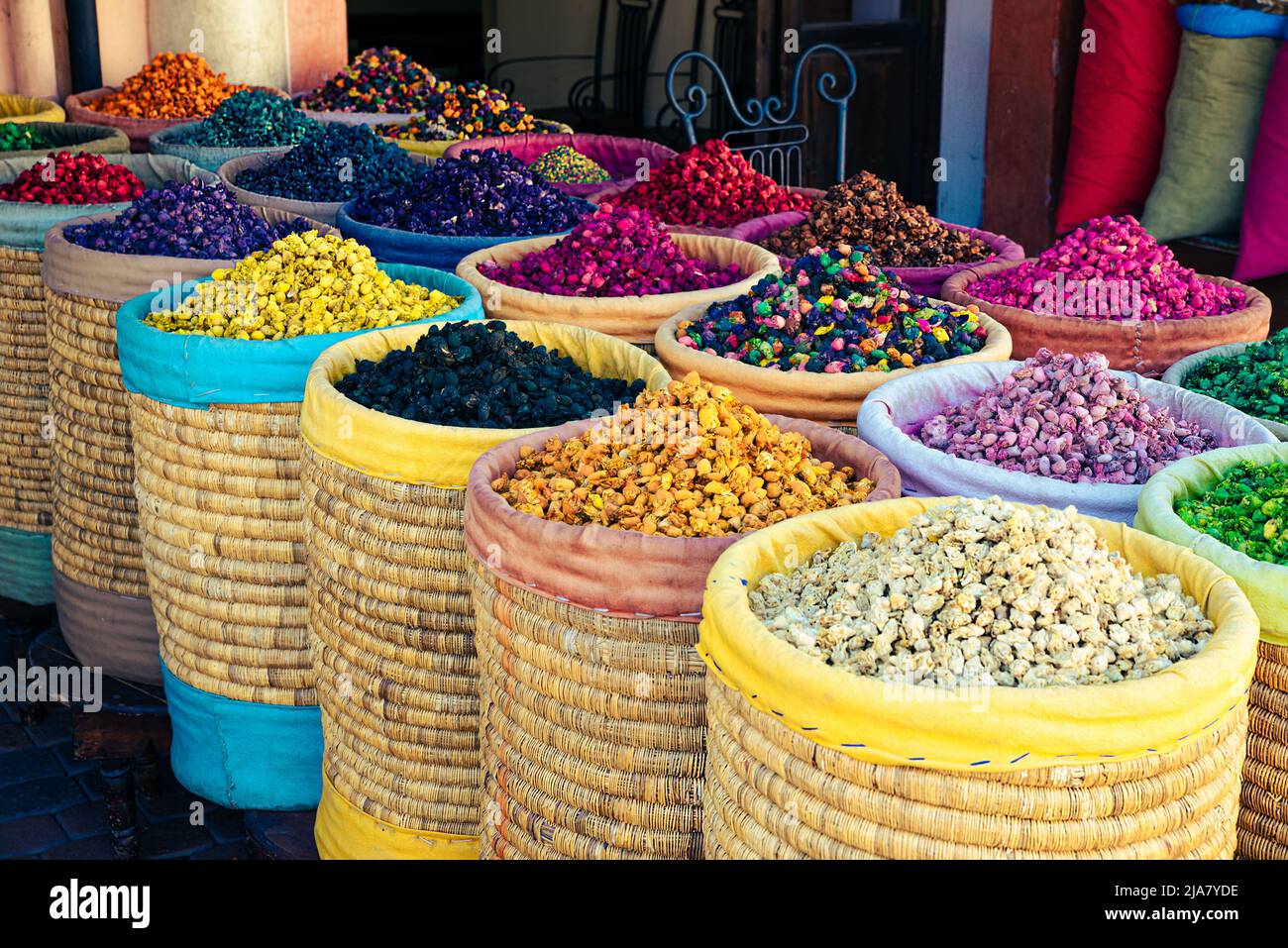 Different colored spices stored in open bags at an Arabic store in Morocco Stock Photo