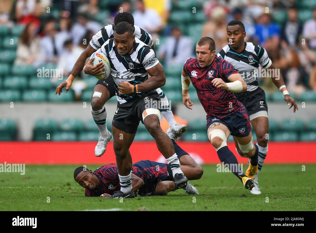 Elia Canakaivata of Fiji Rugby, evades the tackle from Perry Baker of USA, Stock Photo