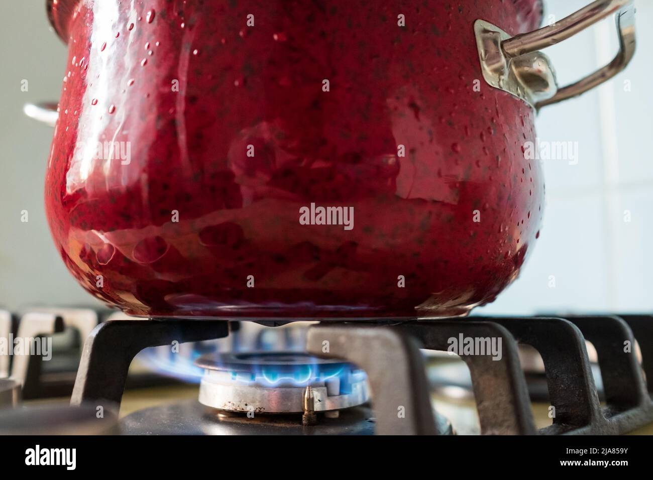 Boiling water in the pot on the gas stove. Preparing food on gas Stock Photo Alamy