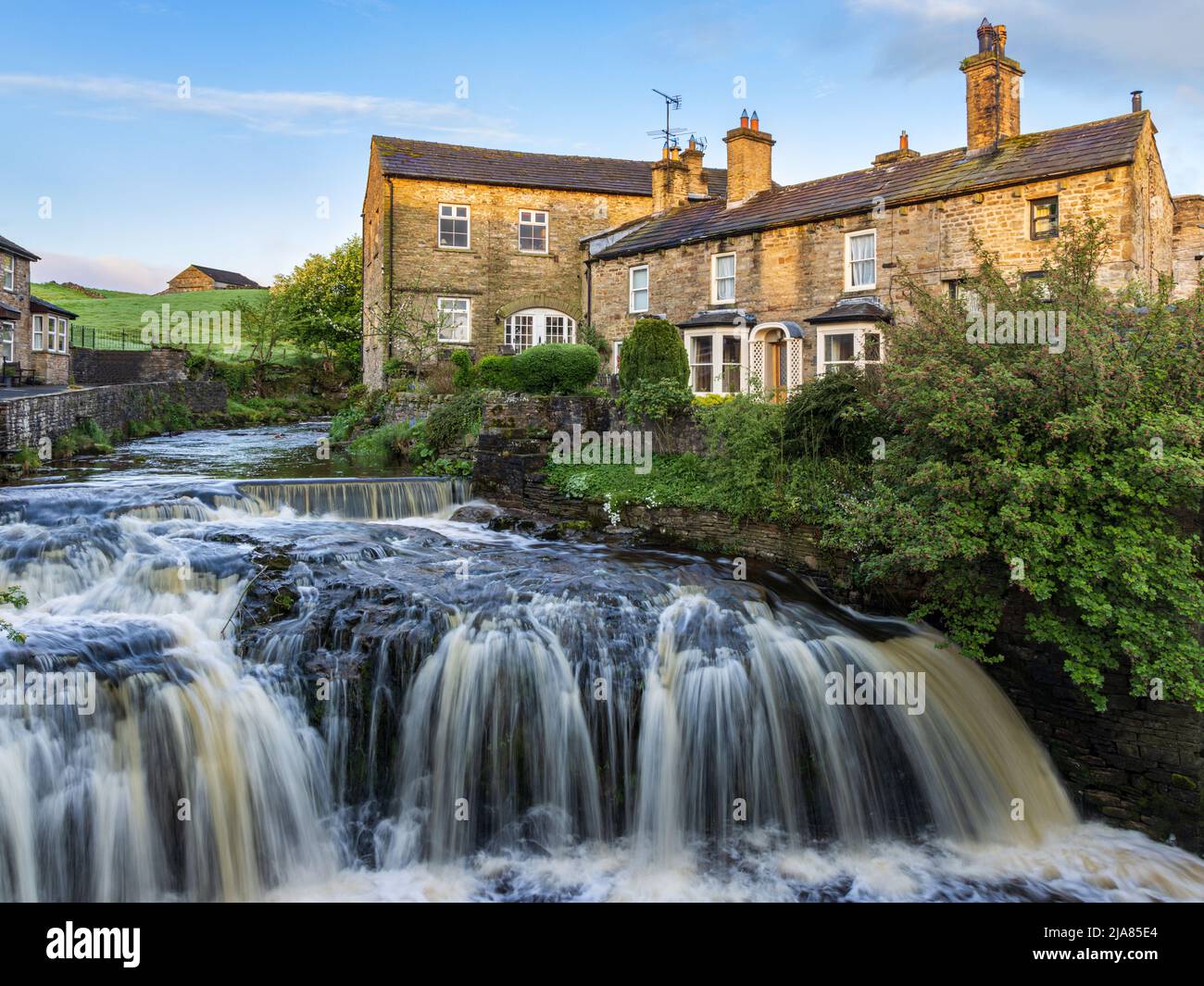 Waterfall on Gayle Beck in the centre of the Yorkshire Dales town of Hawes, Wensleydale. Taken early morning. Stock Photo