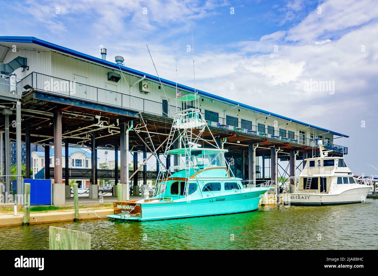 Luxury yachts are docked outside McElroy’s Harbor House Restaurant, May 11, 2022, in Biloxi, Mississippi. Stock Photo