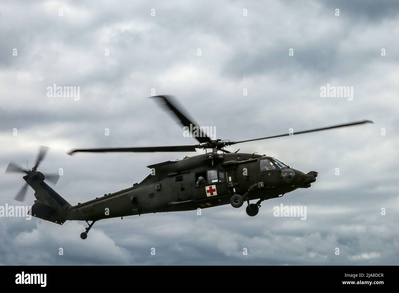 U.S. Soldiers conduct medical evacuation training in a MH-60 Blackhawk during Exercise Combined Resolve 17 (CbR 17) at Hohenfels Training Area, Joint Multinational Readiness Center (JMRC) in Hohenfels, Germany, May 26, 2022. CbR 17 is a United States Army Europe-Africa directed, 7th Army Training Command executed exercise that takes place at JMRC from May 20 to June 19, 2022. The event is designed to evaluate and assess a unit's ability to conduct operations in a complex, multi-domain simulated battle space. The focus of the rotation is to exercise combined arms operations in a multinational e Stock Photo