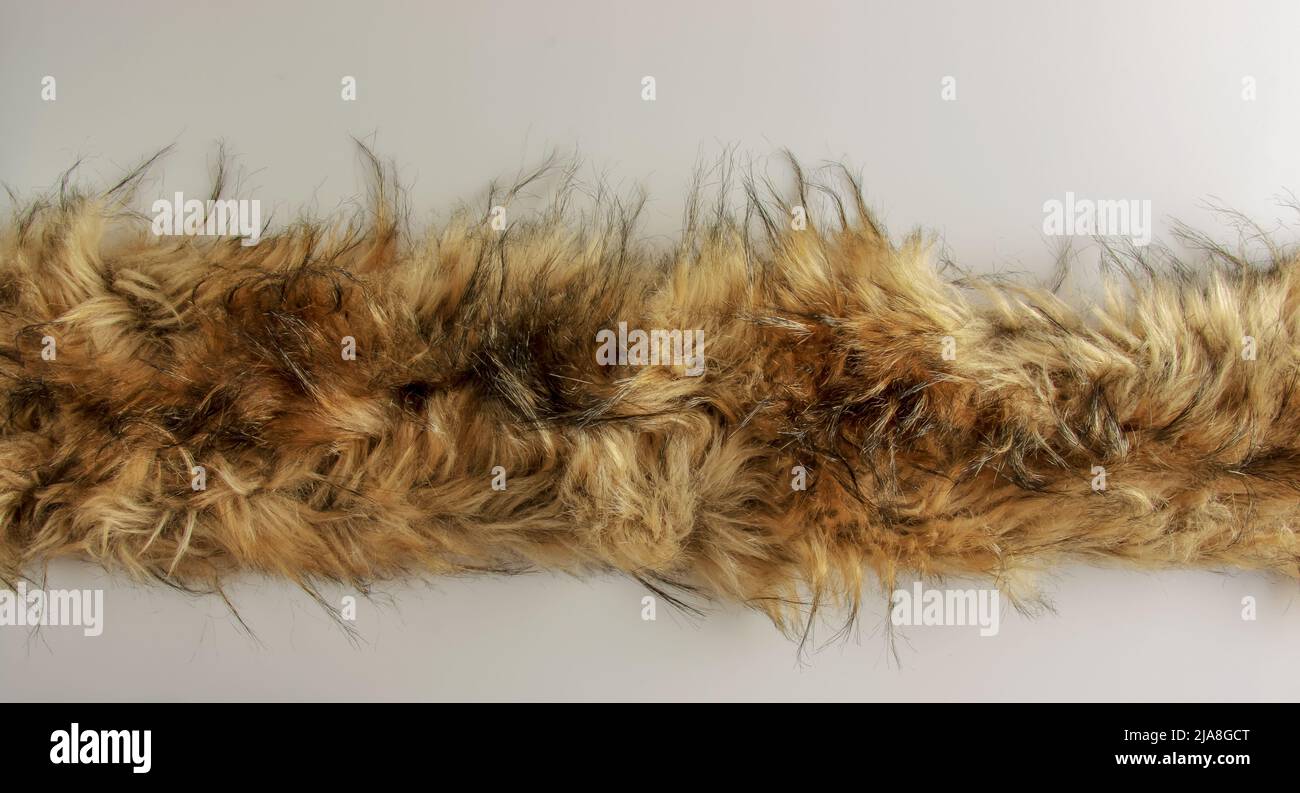 Background black-brown fur. Animal fox fur texture. Stock Photo