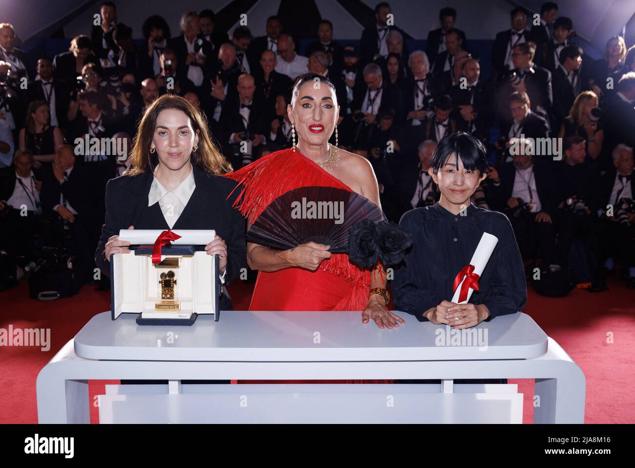 President of the Camera d'or jury, Rossy De Palma (C) poses with Director Chie Hayakawa (L) who won the Special Mention for a first film winner for 'Plan 75' and Director Gina Gammell (R) who won the Caméra d’or Award for a first film for 'War Pony' during the 75th annual Cannes film festival at Palais des Festivals on May 28, 2022 in Cannes, France. Photo by David Boyer/ABACAPRESS.COM Stock Photo