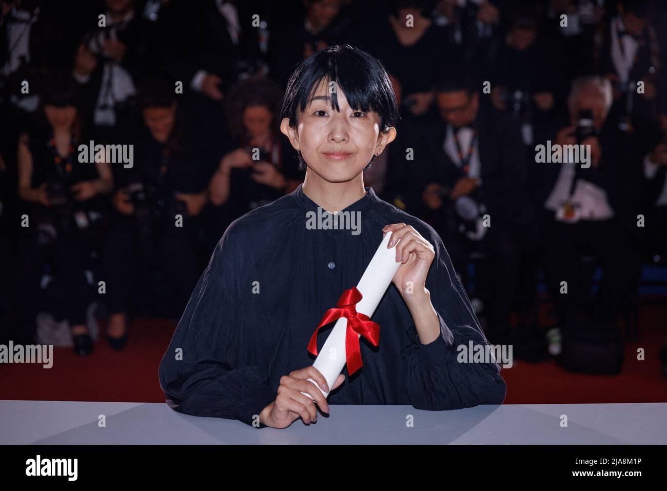 Director Hayakawa Chie poses with the Special Mention Award for a first film for 'Plan 75' during the winner photocall during the 75th annual Cannes film festival at Palais des Festivals on May 28, 2022 in Cannes, France. Photo by David Boyer/ABACAPRESS.COM Stock Photo