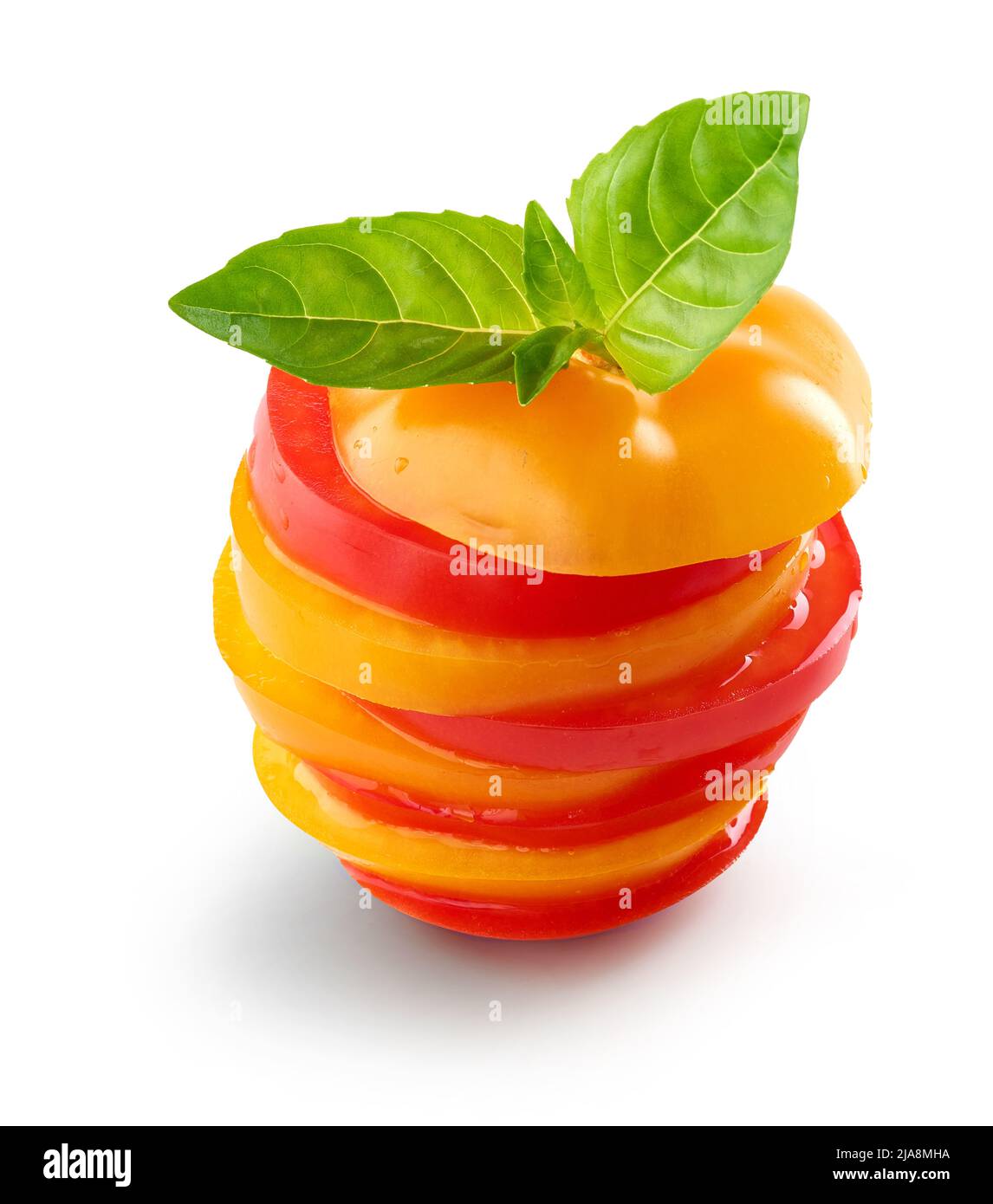 stack of red and yellow tomato slices isolated on white background ...
