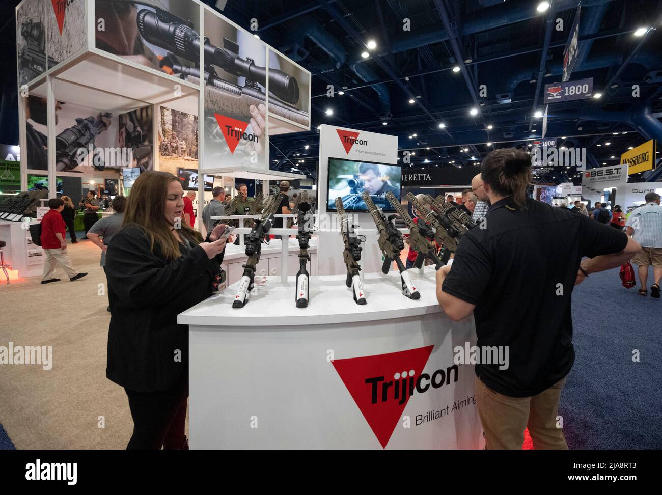 Houston, Texas, USA. 28th May, 2022. Gun enthusiasts shop for firearms, ammunition and outdoor products at the Trijicon booth Saturday morning at the National Rifle Association's (NRA) trade show. The exhibits cover almost 14 acres inside the George R. Brown Convention Center. (Credit Image: © Bob Daemmrich/ZUMA Press Wire) Stock Photo
