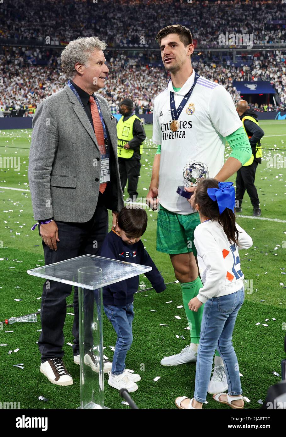 Paris, France. 28th May, 2022. American actor Will Ferrell gives the 'man  of the match' trophy to goalkeeper of Real Madrid Thibaut Courtois  following the UEFA Champions League Final football match between