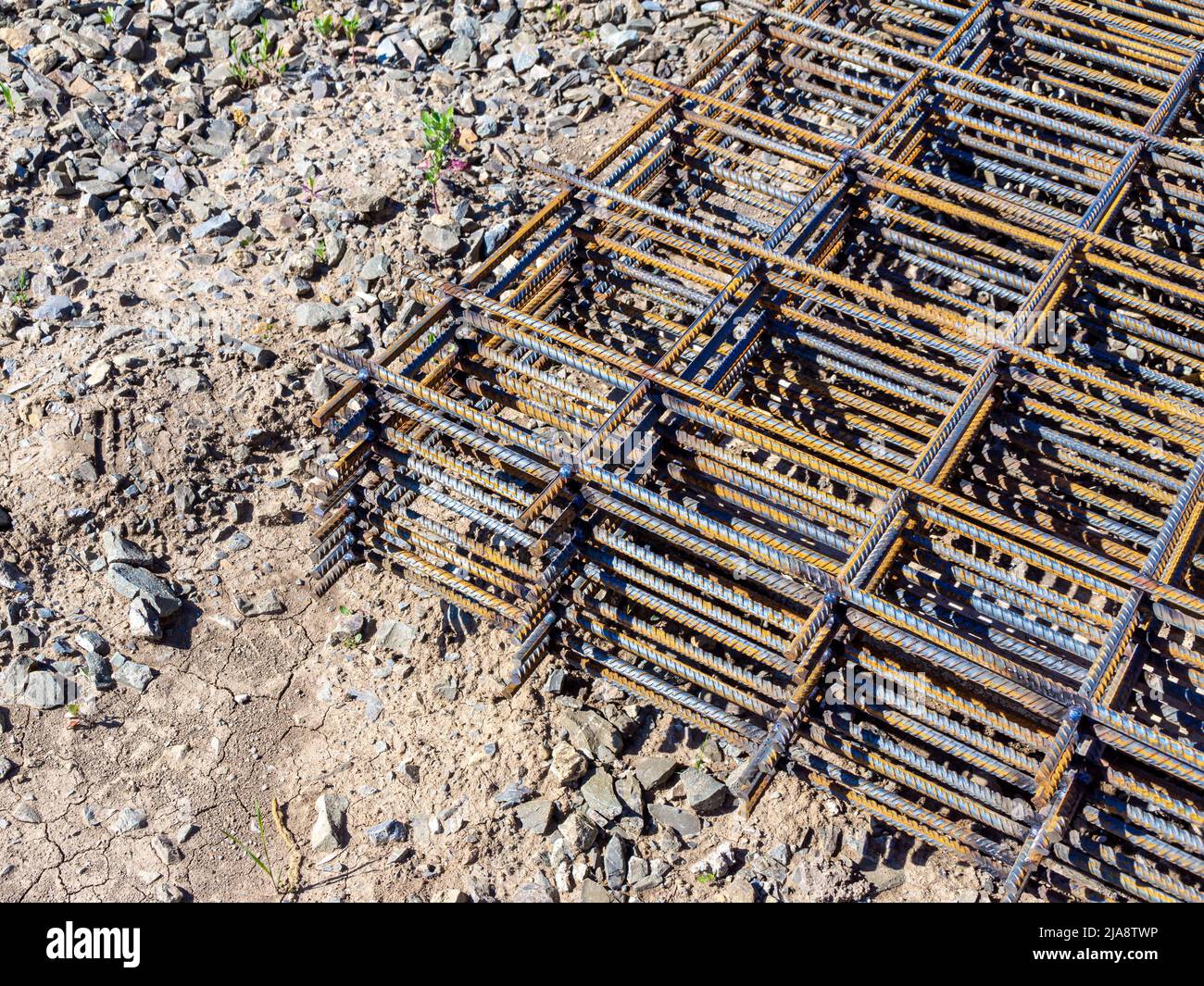 reinforcing mesh lies on the ground, waiting to rise to the mounting horizon, selective focus Stock Photo