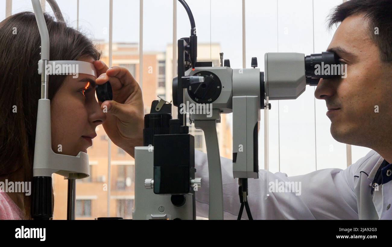 Ophthalmology treatment a young woman checking her visual acuity