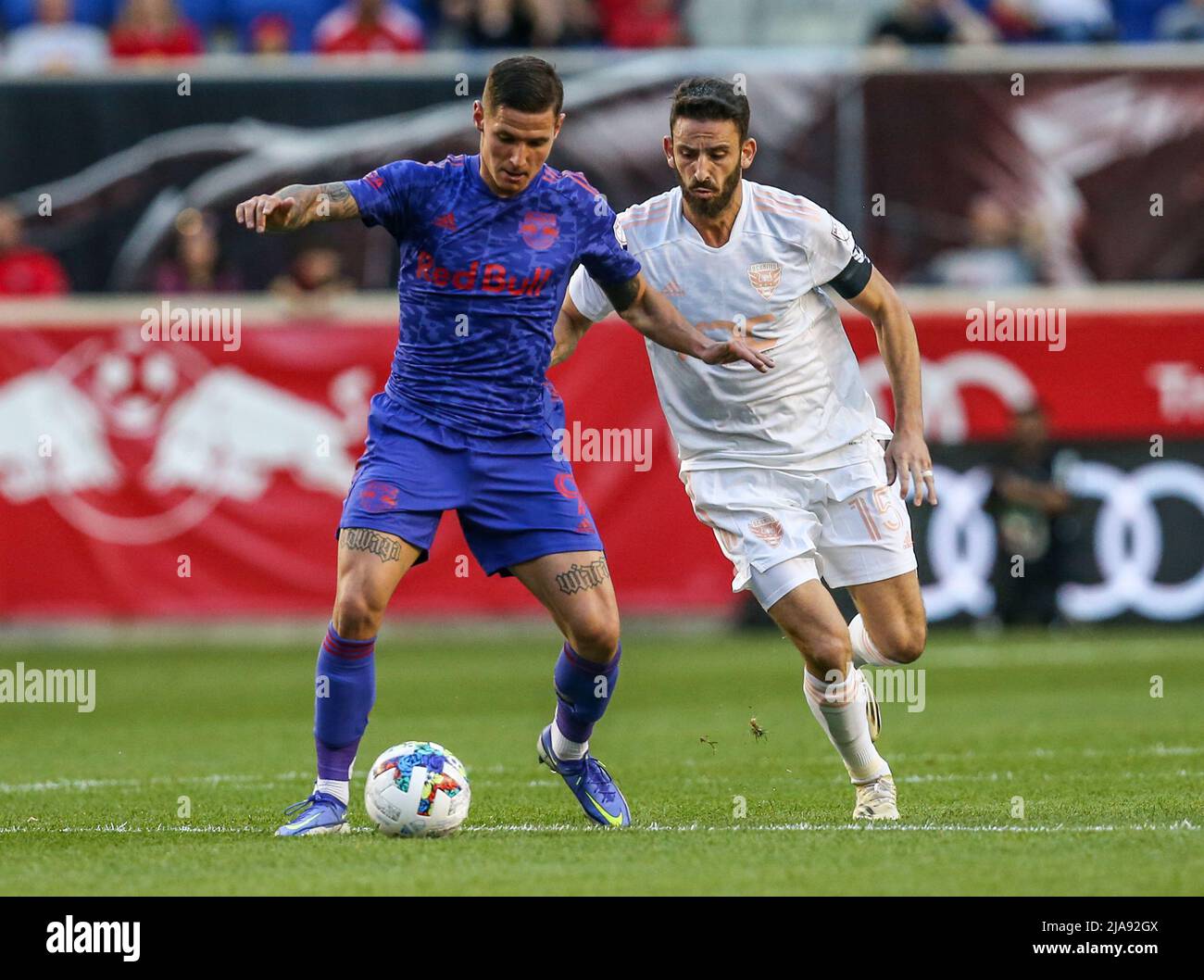 May 28, 2022: New York Red Bulls forward Patryk Klimala (9) and D.C. United forward Nigel Robertha (19) race to the ball during a MLS game between DC United and the New York Red Bulls at Red Bull Arena in Harrison, NJ. The Red Bulls defeated DC United 4-1. Mike Langish/Cal Sport Media. Stock Photo