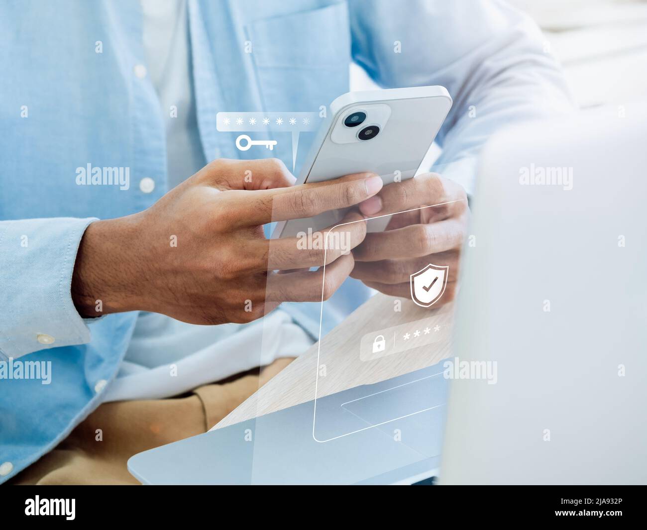 Two factor authentication or 2FA concept. Virtual key icon while access on phone with laptop for validate password, Identity verification, cybersecuri Stock Photo