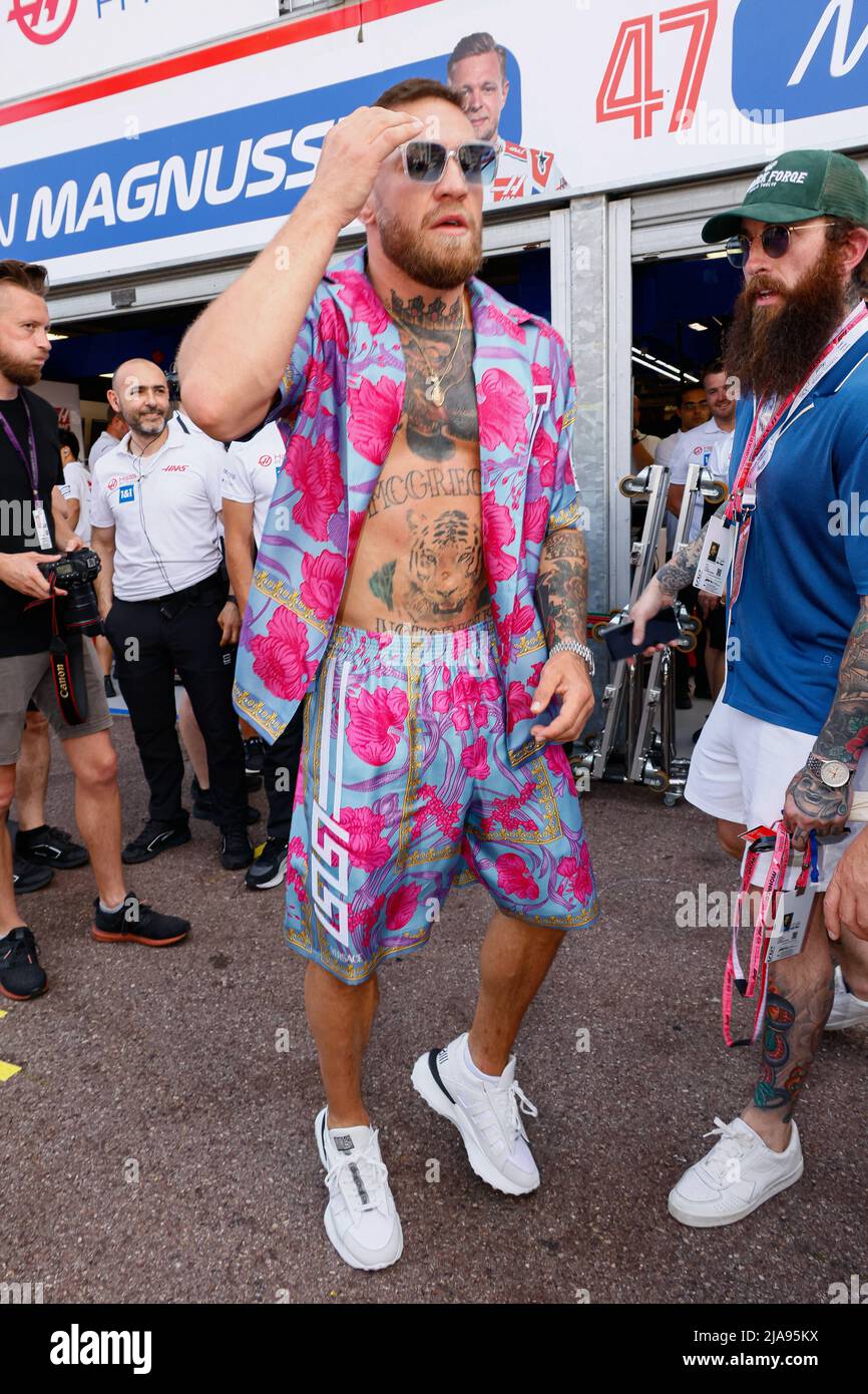 Conor McGregor go to visit his friend driver Kevin Jan Magnussen at Hass paddock along pit lane during the F1 Gran Prix of Monaco on May 28 2022 in Principality of Monaco