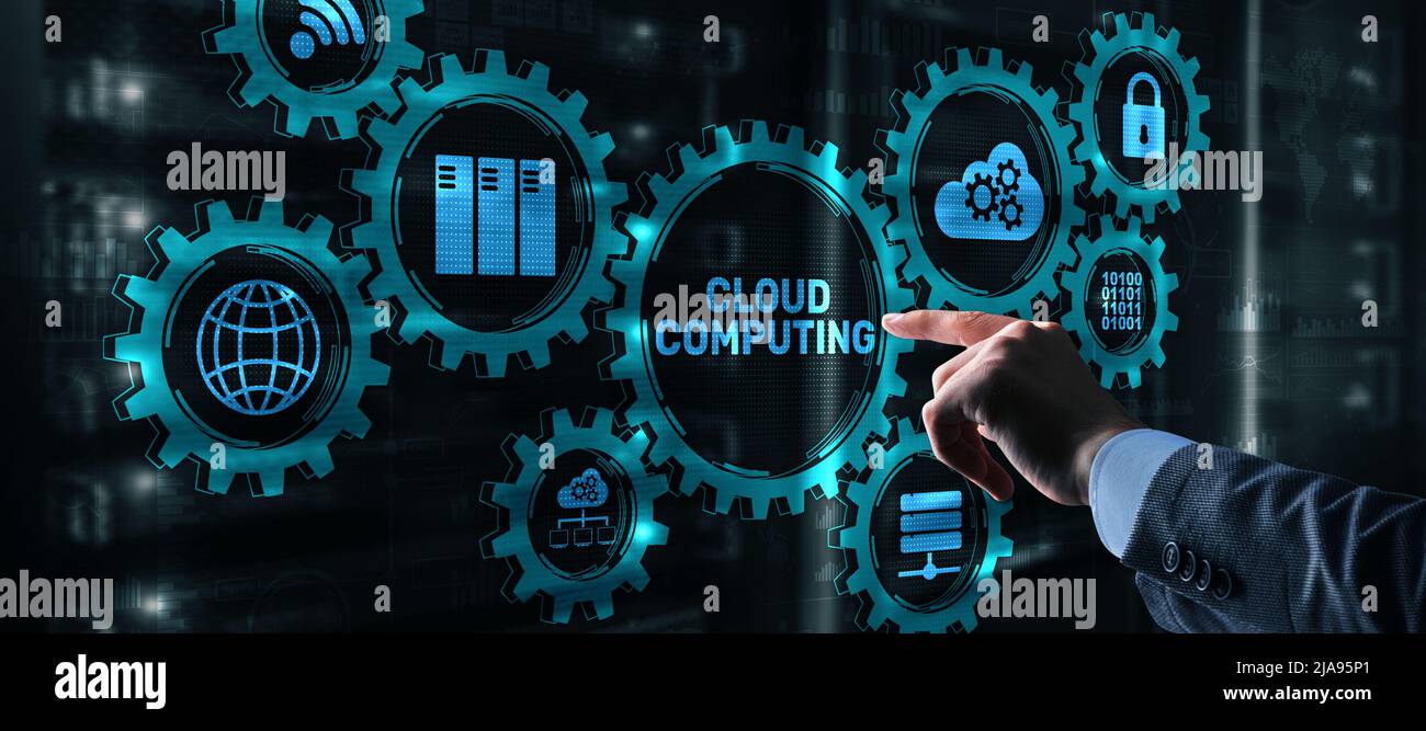 Cloud computing concept. Businessman is pressing on the virtual screen inscription Cloud computing Stock Photo