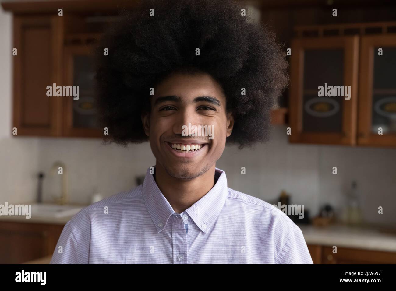 Young Black male look at camera with confident broad smile Stock Photo