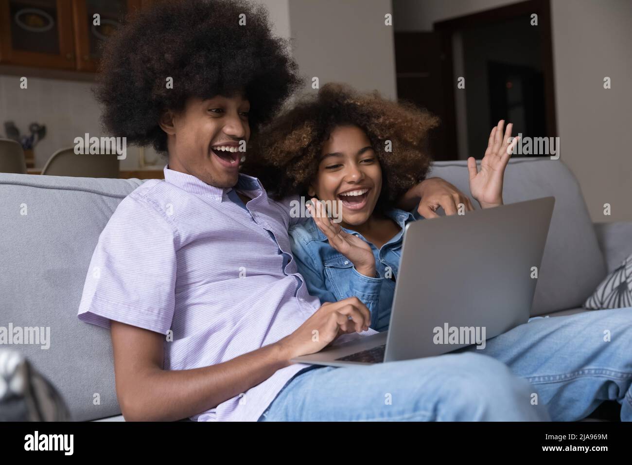 Excited african teen girl laptop hi-res stock photography and images ...