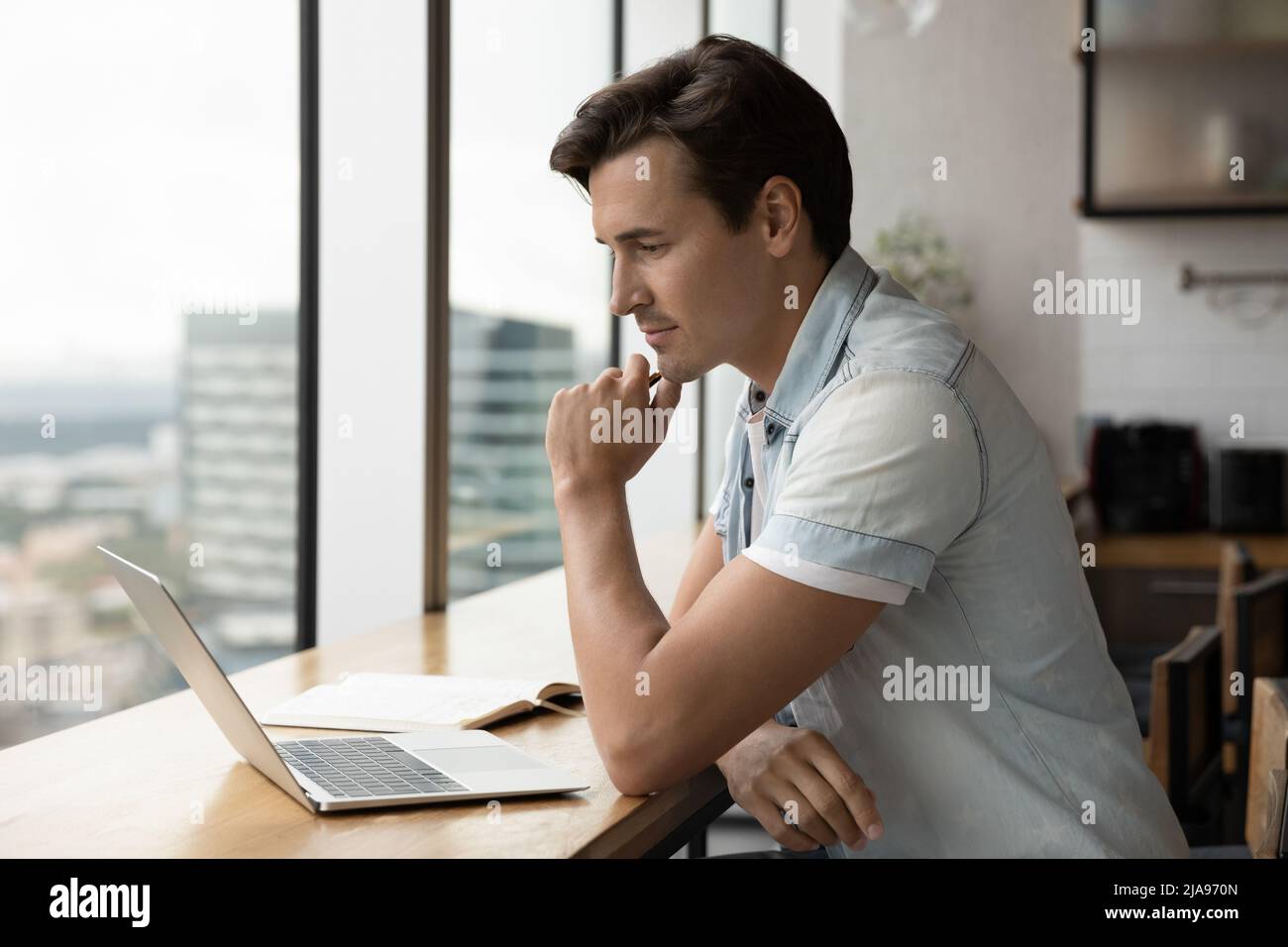 Serious thoughtful adult student watching learning webinar Stock Photo ...