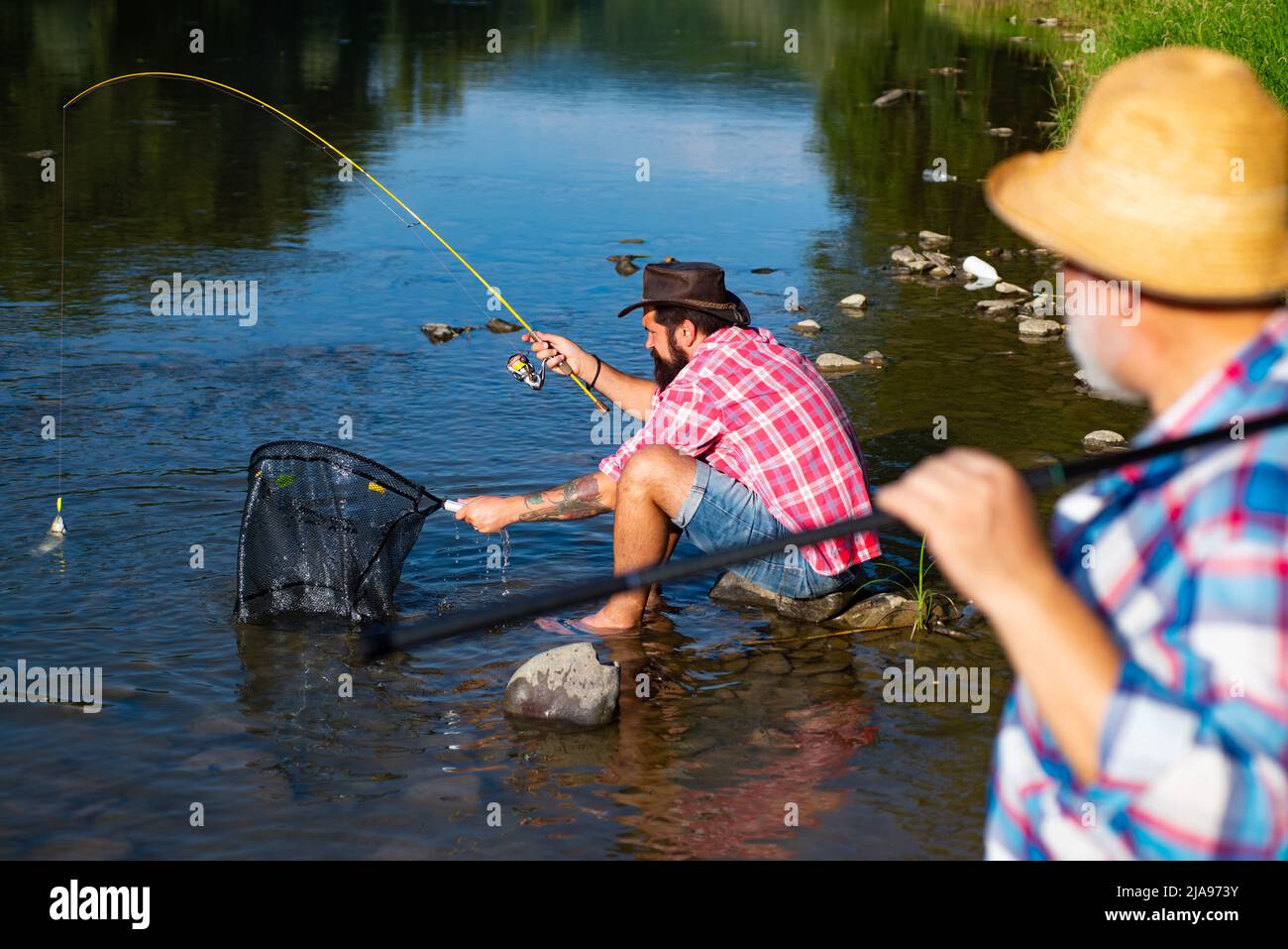 Senior men friends fishing hi-res stock photography and images - Alamy