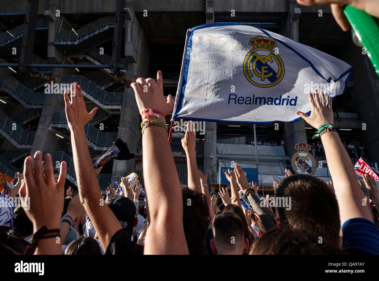 Madrid, Spain. 29th May, 2022. Real Madrid fans gather outside the Santiago Bernabeu stadium before the start of the 2022 UEFA Champions League final match between Liverpool and Real Madrid in Madrid. Real Madrid won its 14th championship after beating Liverpool 1-0 at the Stade de France in Saint-Denis stadium in France. (Photo by Miguel Candela/SOPA Images/Sipa USA) Credit: Sipa USA/Alamy Live News Stock Photo