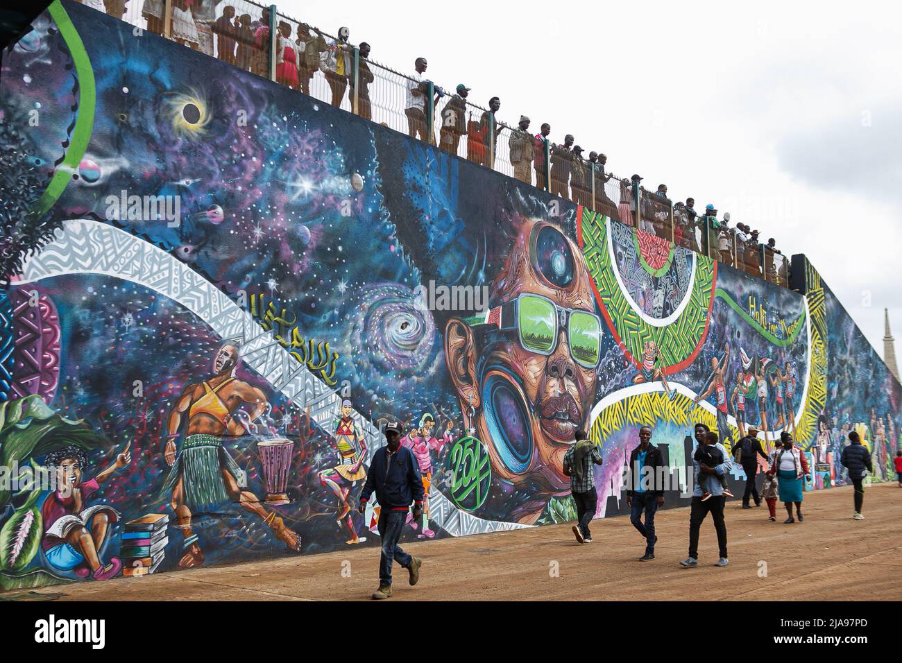 Nairobi, Kenya. 28th May, 2022. Kenyans walk past the murals displayed during the Kenya Defence Forces Air Show at the Uhuru Gardens National Monument and Museum. The free Air Show was a forerunner of commissioning the Uhuru Gardens National Monument and Museum. It was led by Kenya Air Force and included the Kenya wildlife services and civilian aerobatic and sky diving teams. The aim was to entertain and educate the public. (Photo by Boniface Muthoni/SOPA Images/Sipa USA) Credit: Sipa USA/Alamy Live News Stock Photo