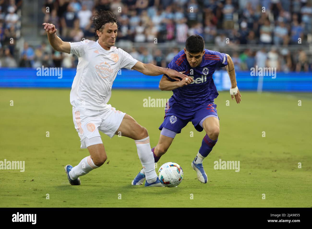 KANSAS Kansas City, KS - MAY 28: Sporting Kansas City defender Ben Sweat (2) tries to steal the ball from Vancouver Whitecaps defender CristiÃ¡n GutiÃ©rrez (3) in the first half of an MLS match between the Vancouver Whitecaps and Sporting KC on May 28, 2022 at Childrenâ€™s Mercy Park in Kansas City, KS. (Credit Image: © Scott Winters/Icon SMI via ZUMA Press) Stock Photo