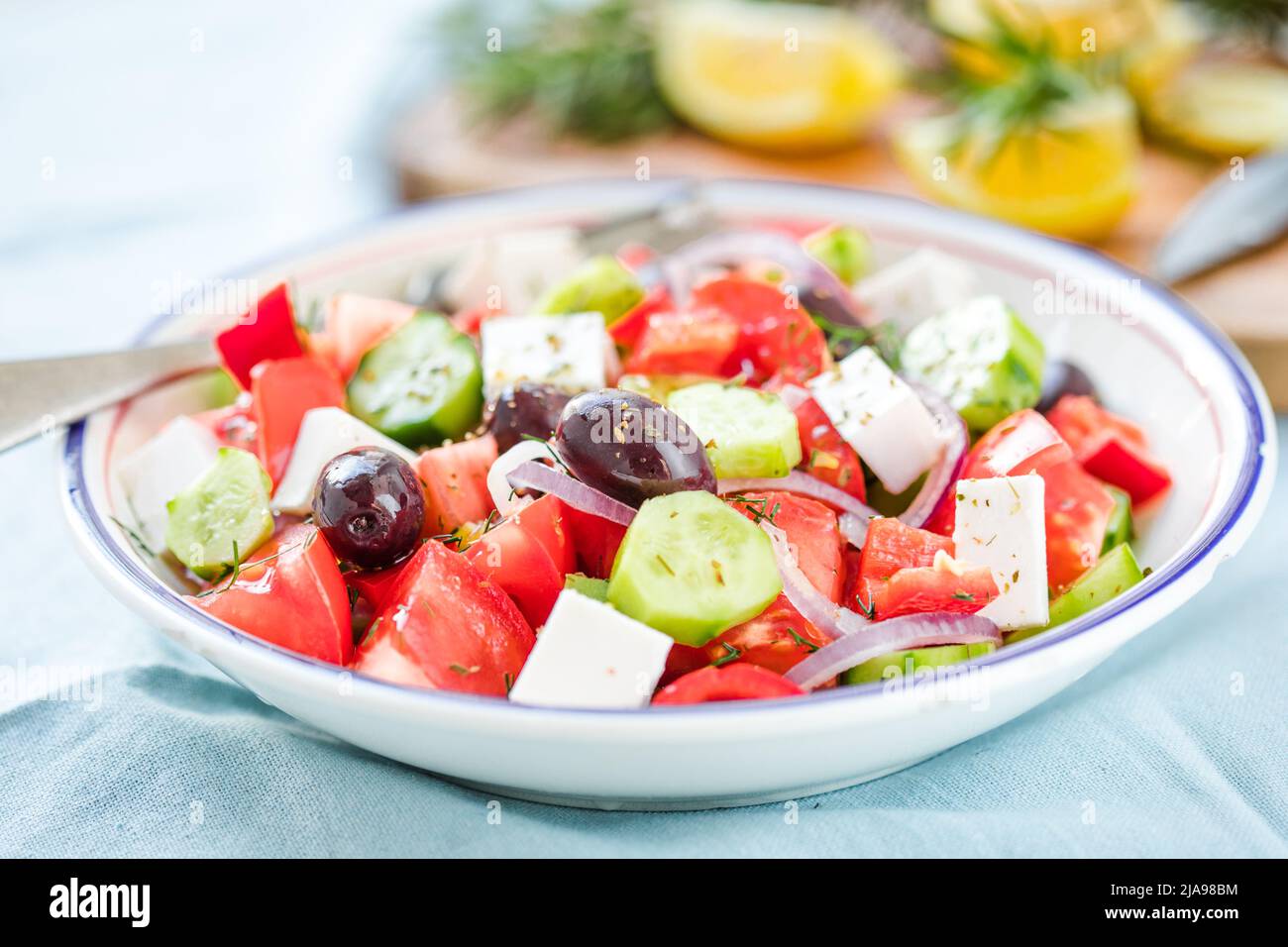 Greek salad with feta cheese, olives, tomato, cucumber and red onion