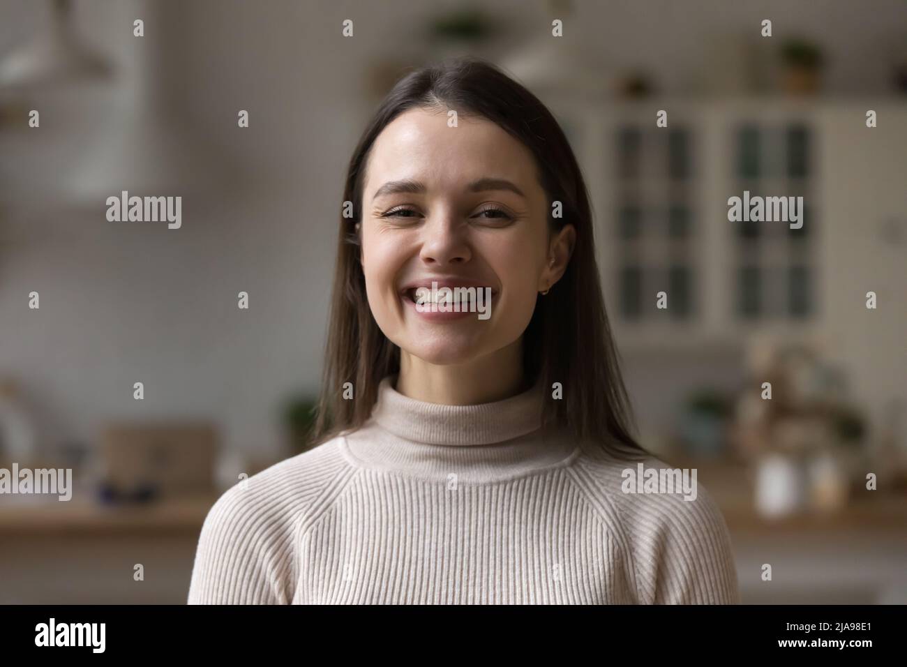 Happy beautiful young Caucasian woman posing at home Stock Photo - Alamy