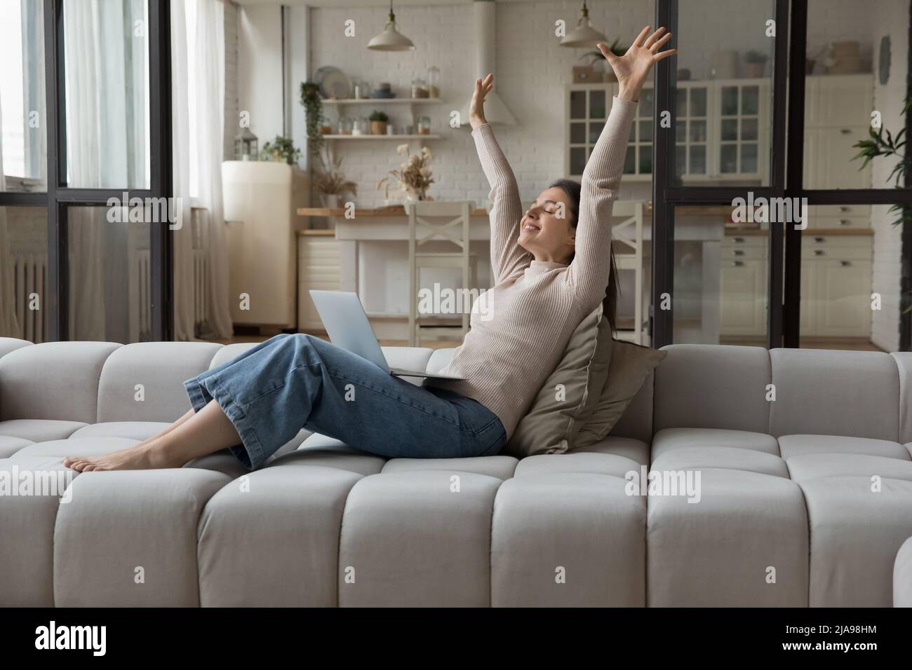 Happy excited millennial girl celebrating success, achieve at laptop ...