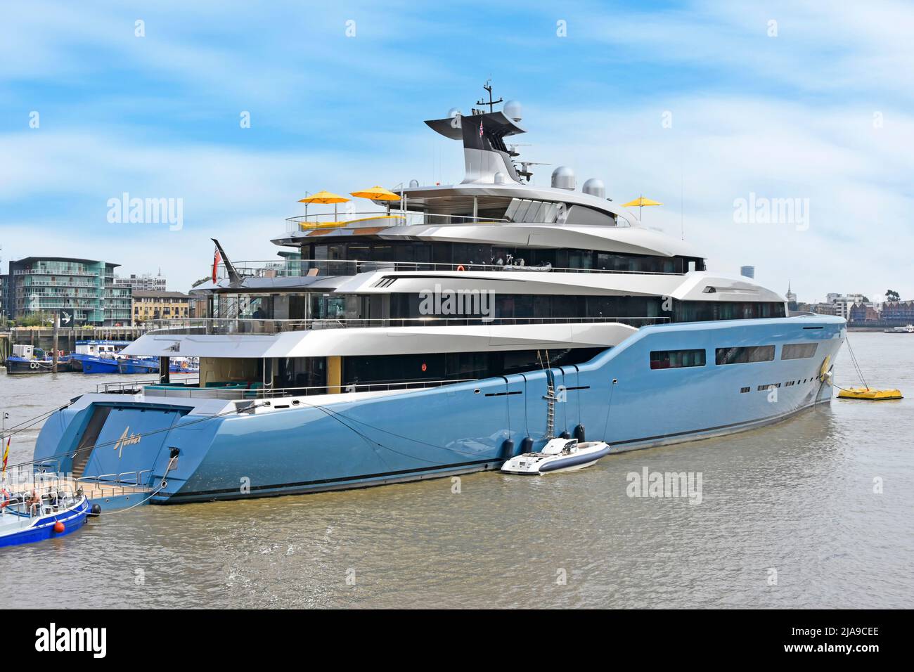 River Thames & mega yacht Aviva moored in Pool of London UK a super yacht built as floating home & office for lwealthy British businessman Joe Lewis Stock Photo