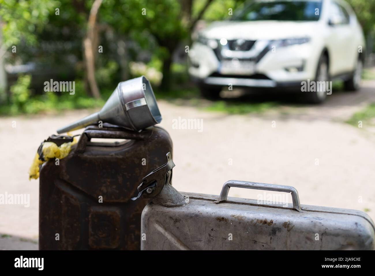 canister and watering can for diesel. the canister with the fuel and