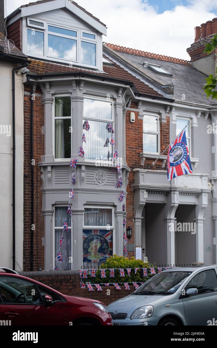 English residential house decorated with Union Jack flags and