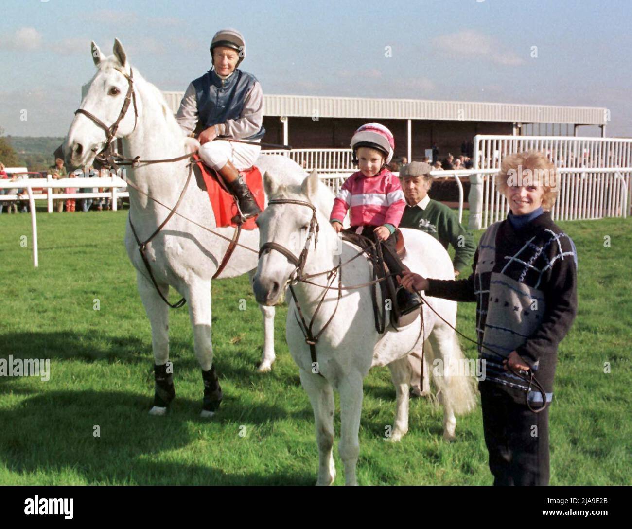 File photo dated 23-10-1997 of Lester Piggott taking part in a celebrity parade aboard Desert Orchid at Wincanton, with his son Jamie, who took part on a pony. Lester Piggott, whose Classic haul included nine Derby victories, has died at the age of 86, his son-in-law William Haggas has announced.. Issue date: Sunday May 29, 2022. Stock Photo