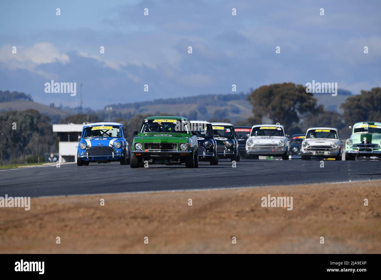 Winton, Australia. 29 May, 2022. Off the line the green 1972 Holden GTR XU1 of Andrew Girvan takes charge down the main start-finish straight at Winton Raceway for the Group N race at Historic Winton. Historic Winton is Australia's largest and most popular all-historic motor race meeting. Credit: Karl Phillipson/Optikal/Alamy Live News Stock Photo